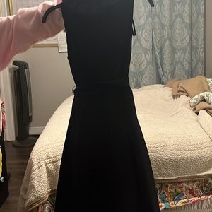 Black pleated dress with ruffle flowered ruffle neck short sleeved